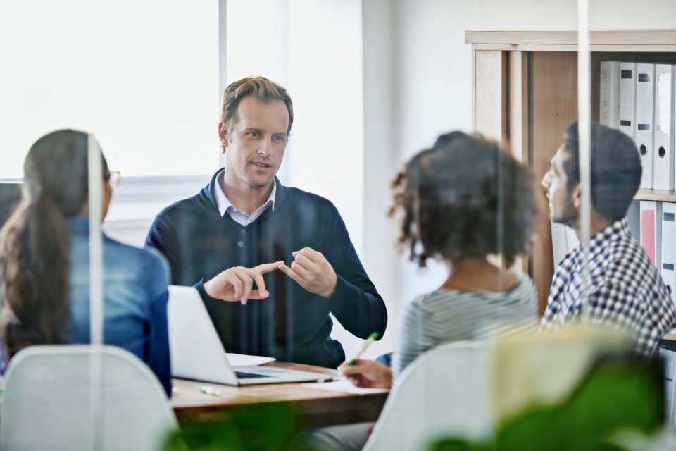 A team discussing work around a table